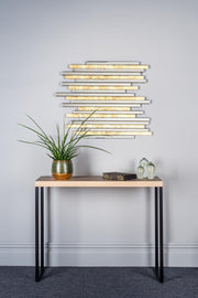 Console table with decorative items against a gray wall