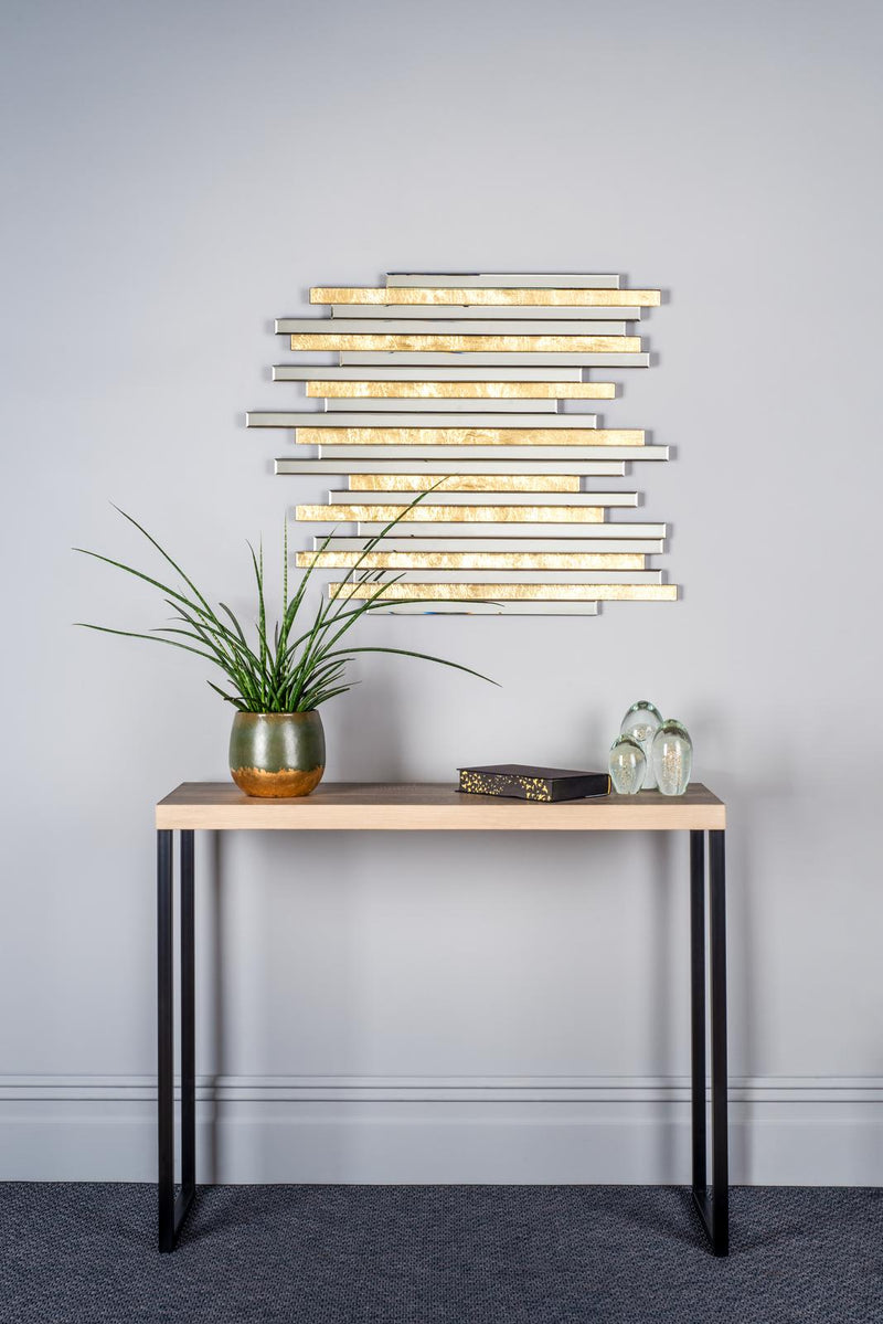 Console table with decorative items against a gray wall