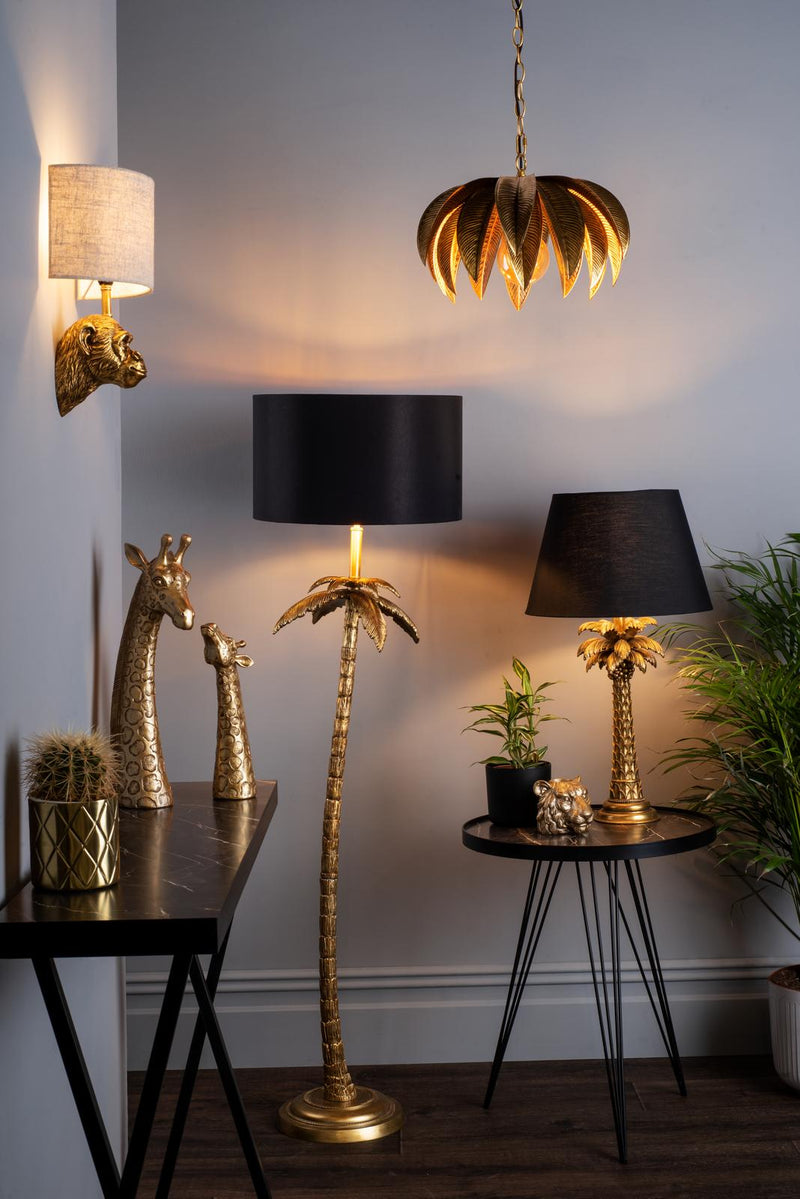 Decorative lamps and giraffe statues in a room setting.